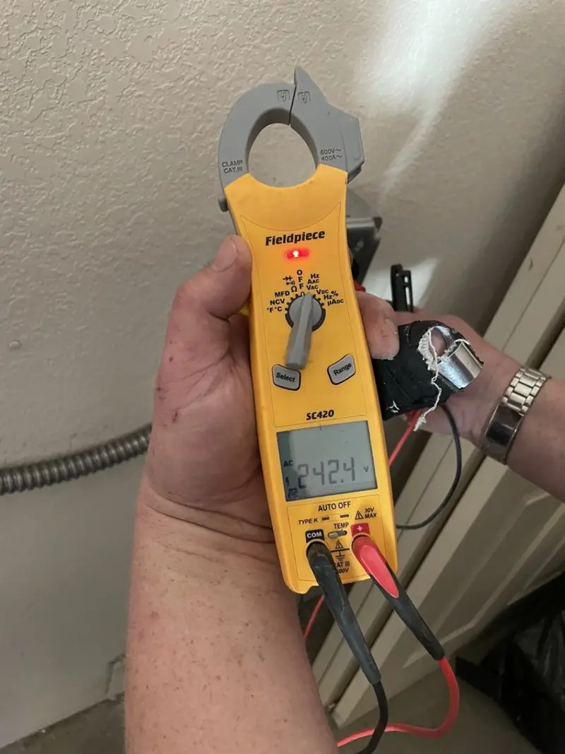 Voltage testing with clamp meter during Aluminum Wiring Replacement in Ames